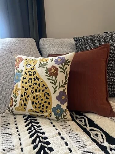 Floral Leopard pillow cover styled on a sofa